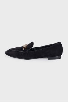 Black suede loafers with gold trim