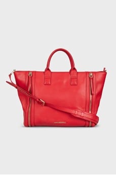 Red leather bag with decorative zippers