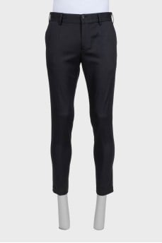 Men's black straight-leg trousers with creases