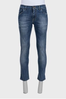 Men's blue jeans with a distressed effect