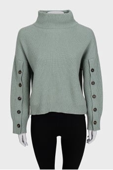 Cashmere sweater with buttons on the sleeves