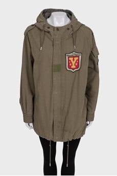 Green parka with a patch