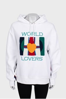 White hoodie decorated with embroidery