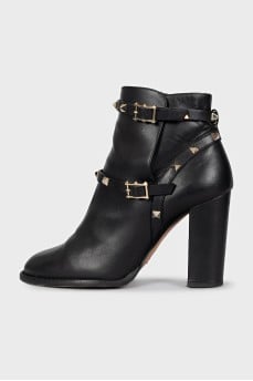 Leather ankle boots with heels decorated with studs