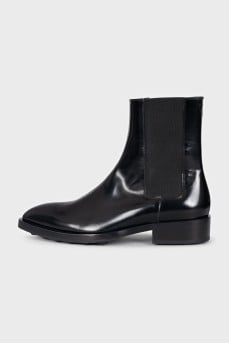 Black leather pointed toe boots