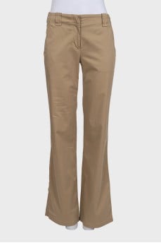 Beige mid-rise trousers with pockets