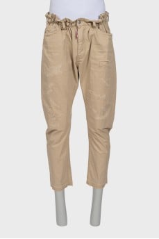 Men's beige trousers with abrasions