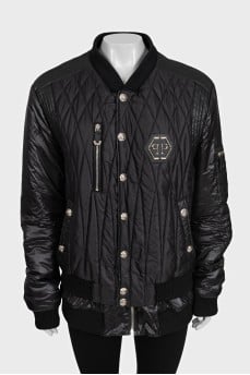 Black quilted bomber jacket with signature logo on the back