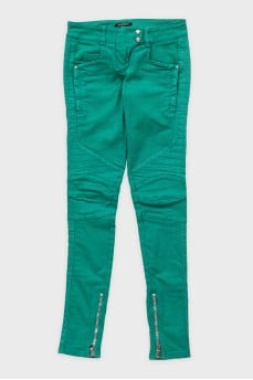Green skinny fit jeans with decorative zippers