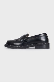 Black leather loafers with silver decor