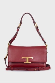 Burgundy leather bag with gold logo