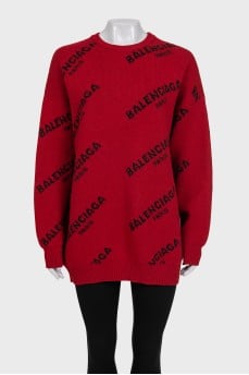 Червоний светр oversize крою у фірмовий принт