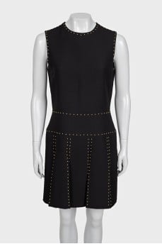Black sleeveless dress with gold trim