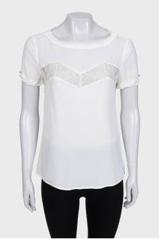 White blouse with short sleeves decorated with lace