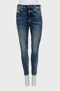 Blue skinny fit jeans with a distressed effect