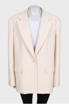 Beige long jacket with a button