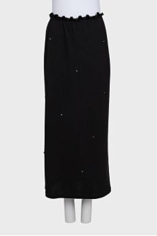 Black fitted skirt decorated with starbursts