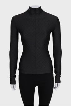 Black turtleneck with a 3D pattern and tag