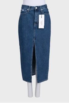 Blue denim skirt with a slit and tag