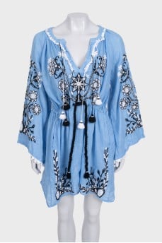 Blue linen dress decorated with embroidery
