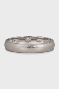 The ring is decorated with a diamond
