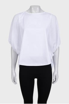A loose blouse decorated with rhinestones