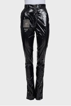 Black patent leather trousers with tag