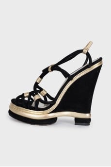 Black suede sandals with gold trim