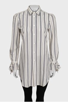 White shirt with striped print and tag