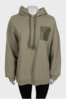 Green hoodie with a patch pocket