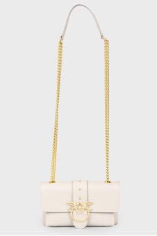 Leather bag on a metal chain, with a tag