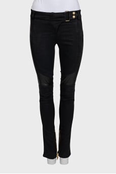 Black trousers with perforations