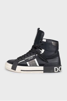 Black high-top sneakers made of leather and suede
