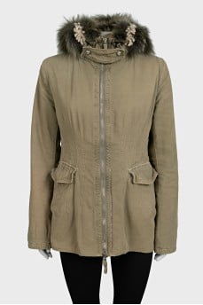 Green parka with a fur hood