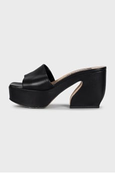 Black leather mules with a shaped heel