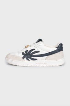 White leather sneakers with a black patch
