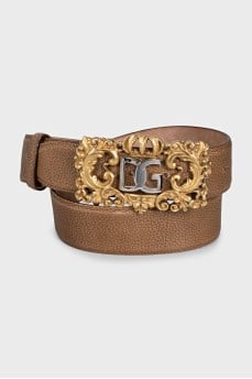 Leather belt with a massive figured buckle