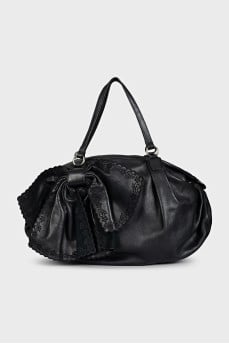 Black leather bag with a bow