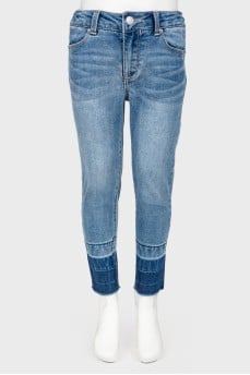 Children's jeans with the effect of torn below
