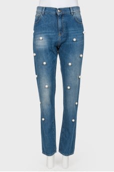 Jeans with pearl effect beads and tag
