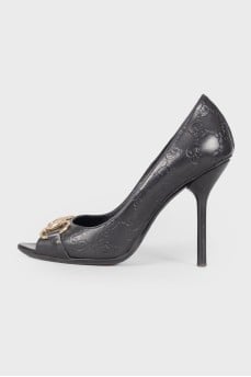Shoes with embossed brand logo