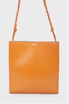 Leather bag with a wicker shoulder belt