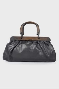 Leather bag with wooden handles