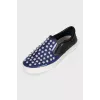 Blue leather slip-ons with decor