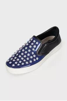 Blue leather slip-ons with decor