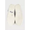 Blue leather slip-ons with decor