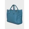 Leather bag with embossed logo