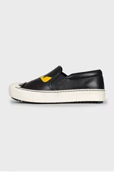 Black leather slip-ons with print
