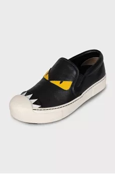 Black leather slip-ons with print