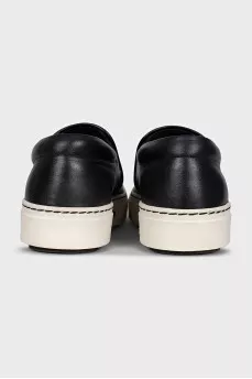Black leather slip-ons with print